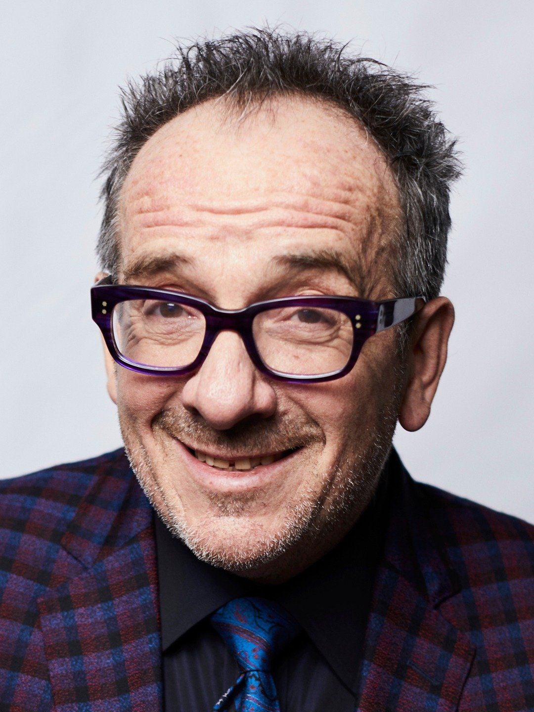 How tall is Elvis Costello?